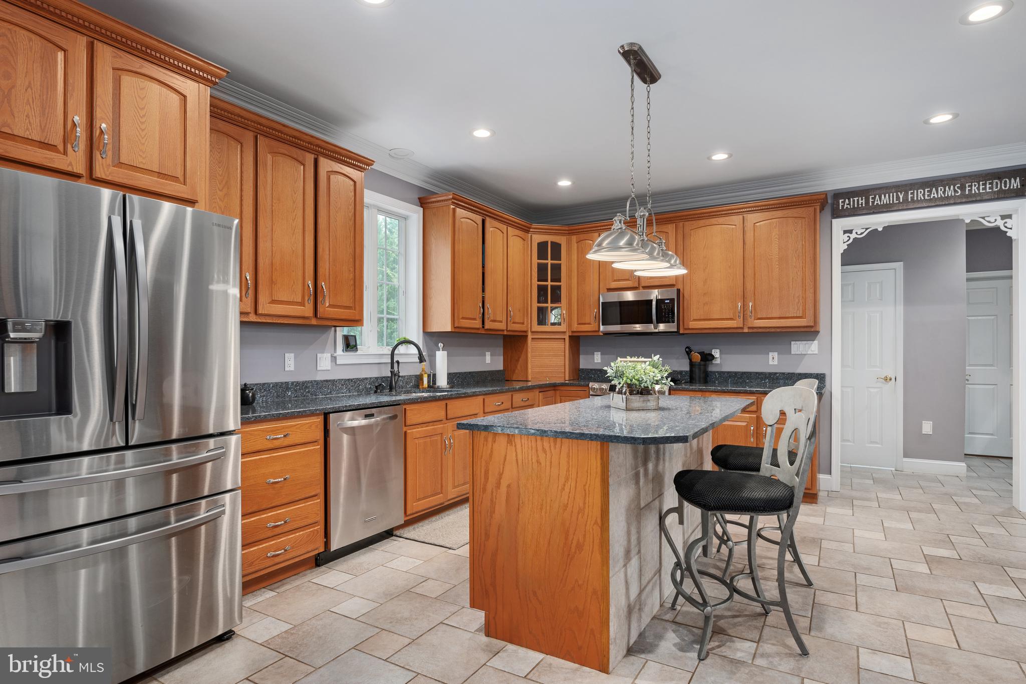 3889 Gamber Road Finksburg, MD 21048 - Photo 14 of 76 a kitchen with stainless steel appliances granite countertop a refrigerator and a stove top oven