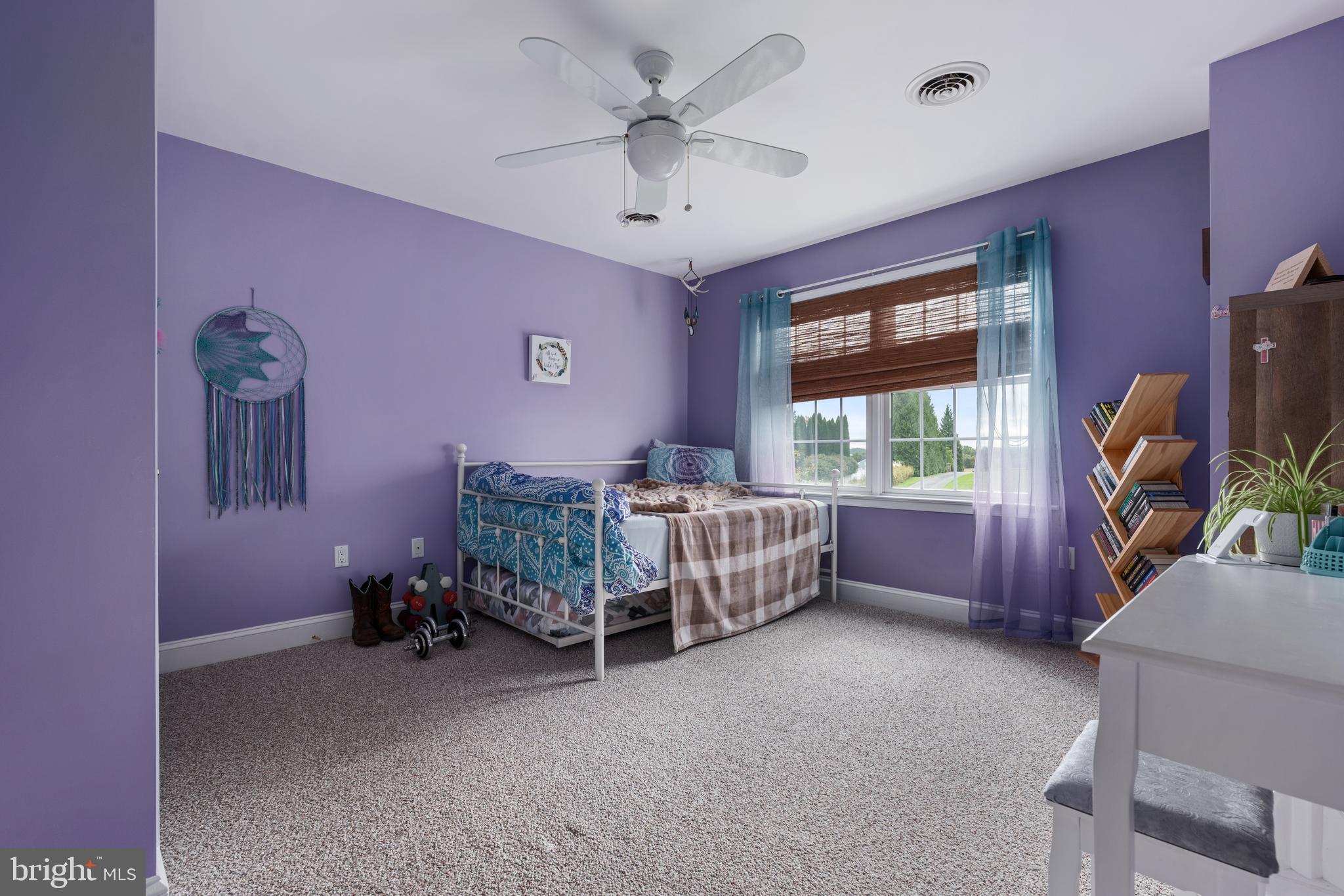 3889 Gamber Road Finksburg, MD 21048 - Photo 40 of 76 a bedroom with a bed and a chandelier fan