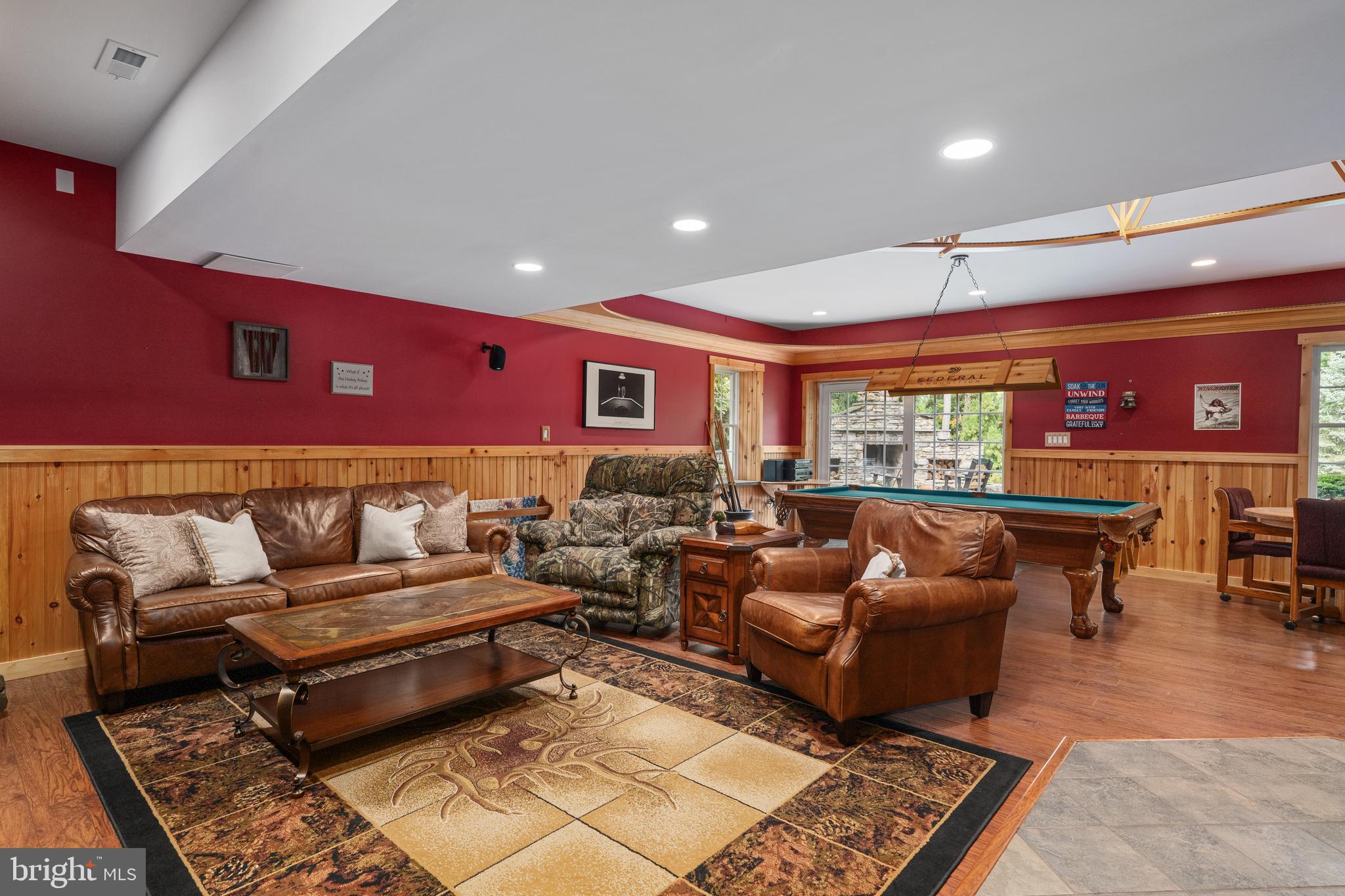 3889 Gamber Road Finksburg, MD 21048 - Photo 41 of 76 a living room with furniture a rug and a projector