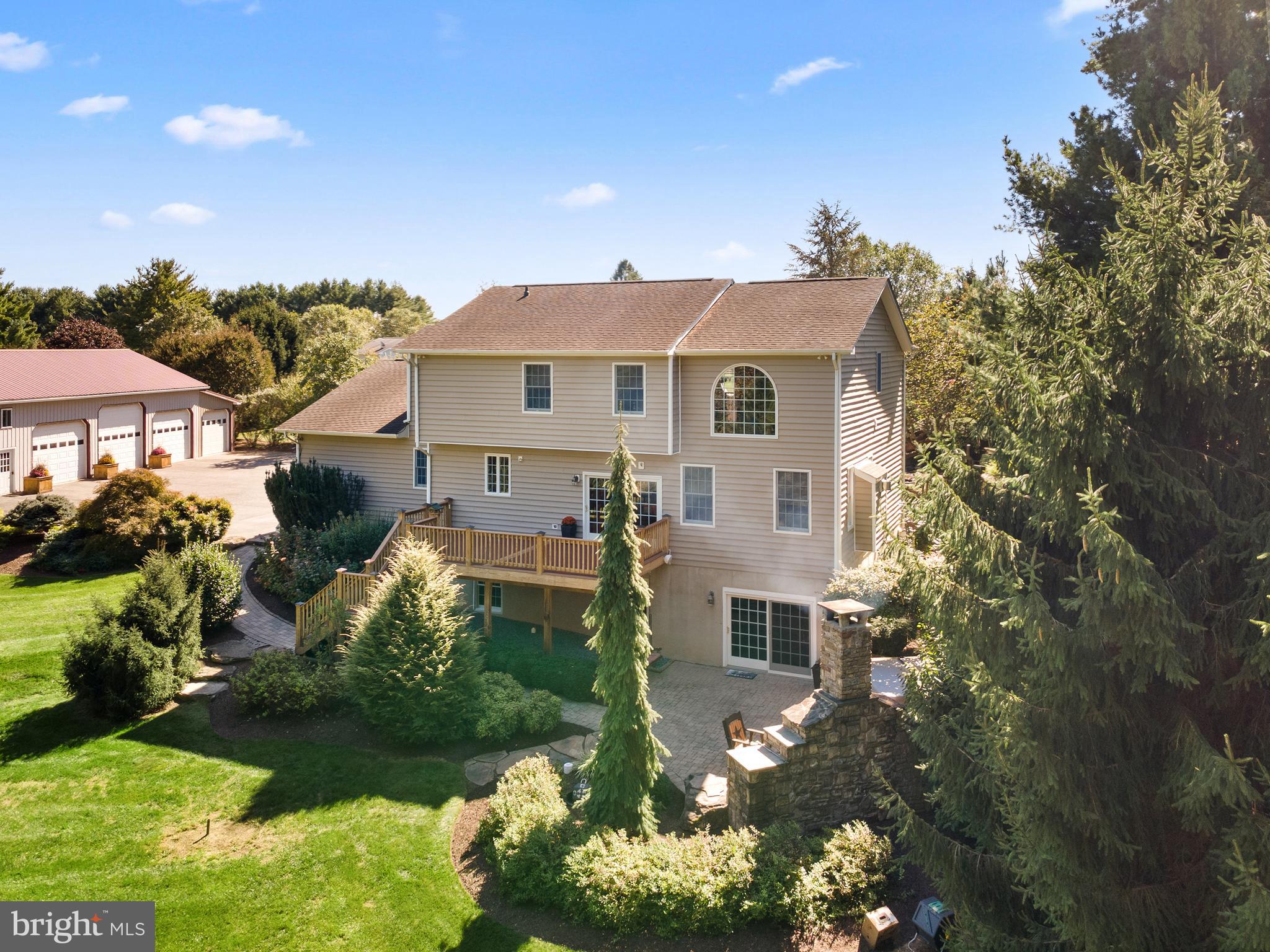 3889 Gamber Road Finksburg, MD 21048 - Photo 55 of 76 a front view of a house with a yard and garage