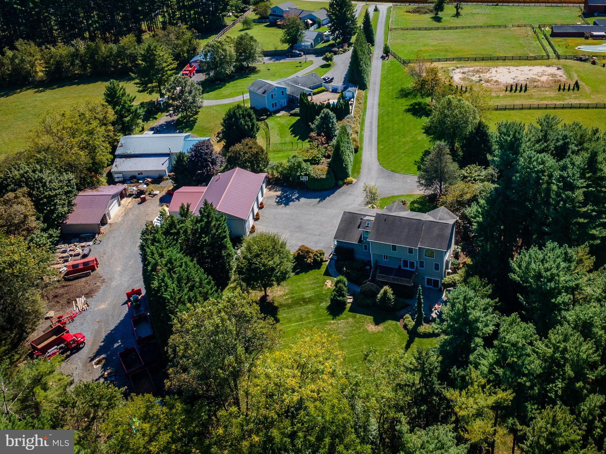3889 Gamber Road Finksburg, MD 21048 - Photo 72 of 76 an aerial view of a house with a yard and lake view