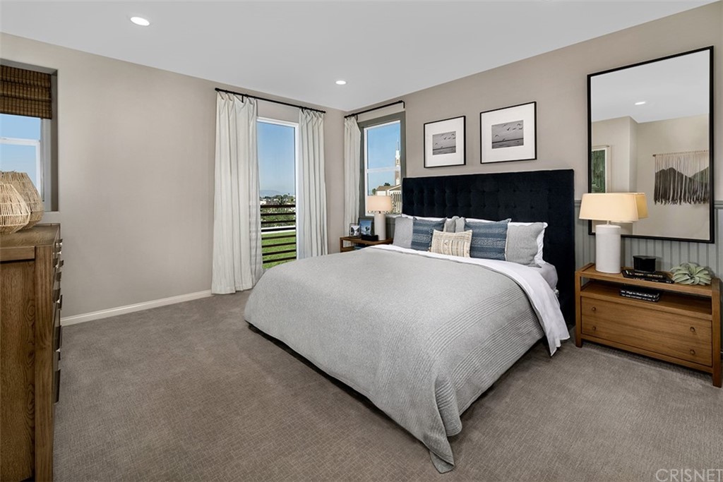 750 Daniel Freeman Circle Inglewood, CA 90301 - Photo 4 of 8 a bedroom with a large bed and a chandelier