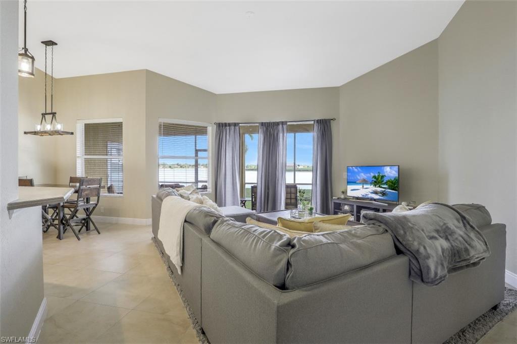 2198 Grove Drive Naples, FL 34120 - Photo 12 of 35 a living room with a bed furniture and a window