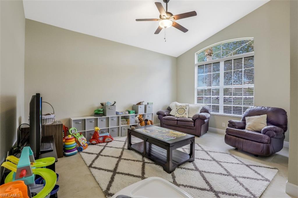 2198 Grove Drive Naples, FL 34120 - Photo 14 of 35 a living room with furniture and a window