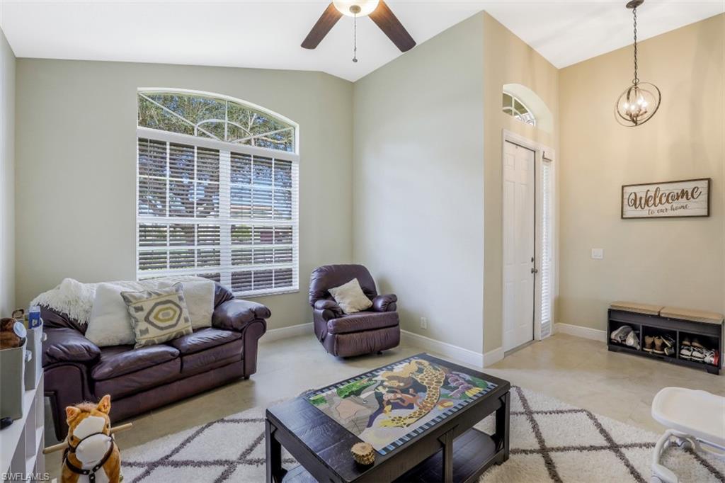 2198 Grove Drive Naples, FL 34120 - Photo 17 of 35 a living room with furniture and a window