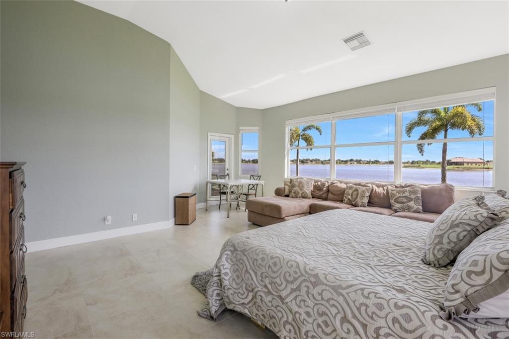 2198 Grove Drive Naples, FL 34120 - Photo 19 of 35 a bedroom with two beds and painting on the wall