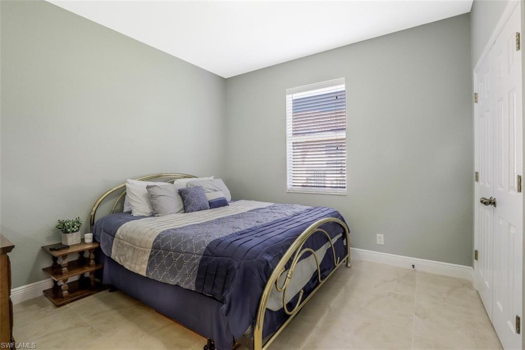 2198 Grove Drive Naples, FL 34120 - Photo 22 of 35 a bed room with a bed and a window