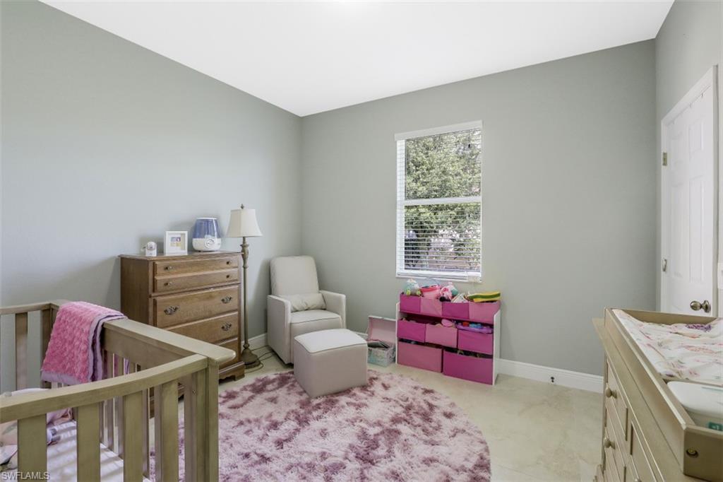 2198 Grove Drive Naples, FL 34120 - Photo 26 of 35 a living room with furniture and window