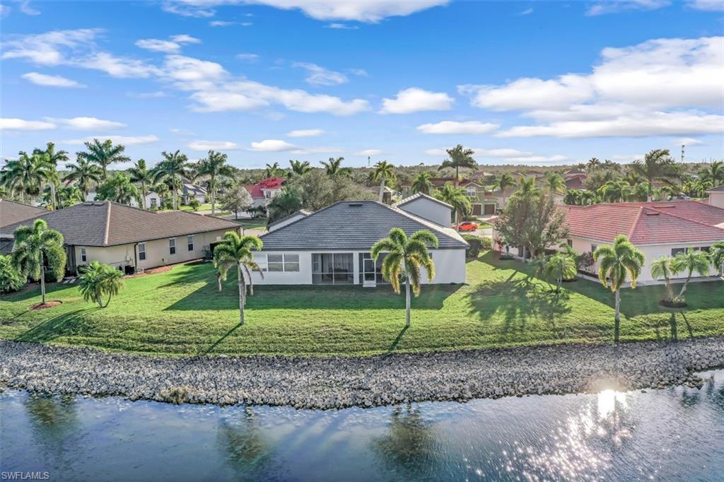 2198 Grove Drive Naples, FL 34120 - Photo 28 of 35 front view of a house with a big yard