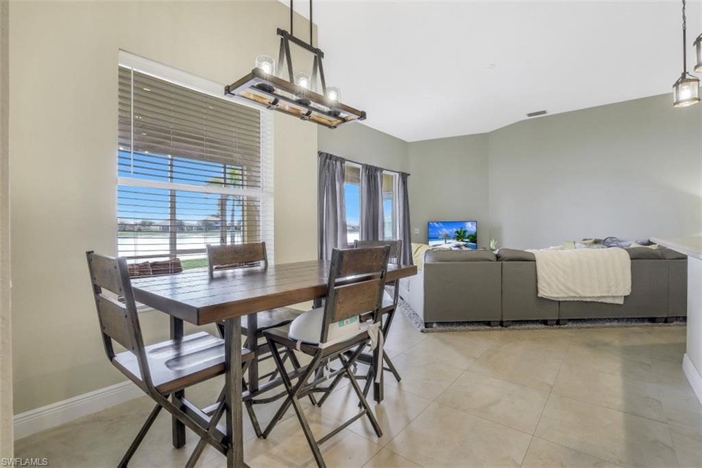 2198 Grove Drive Naples, FL 34120 - Photo 10 of 35 a living room with furniture and a window