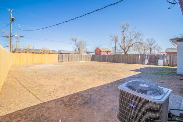 a view of a backyard of the house