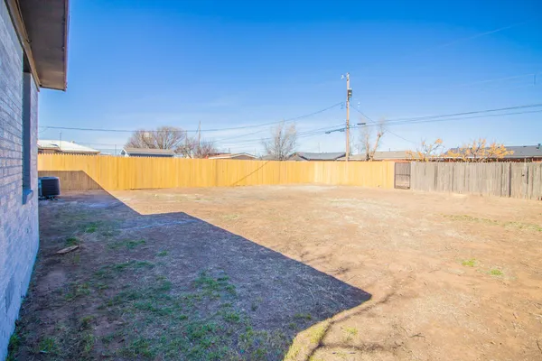 a view of a swimming pool and an outdoor space