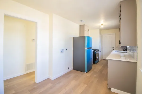 a kitchen with stainless steel appliances cabinets a sink and a window