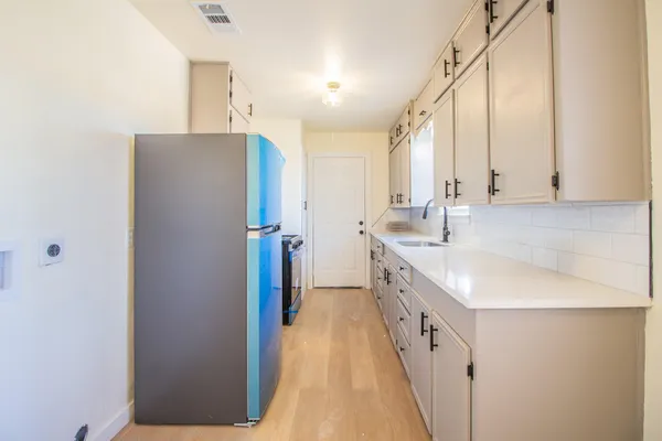 a kitchen with a stove and a sink