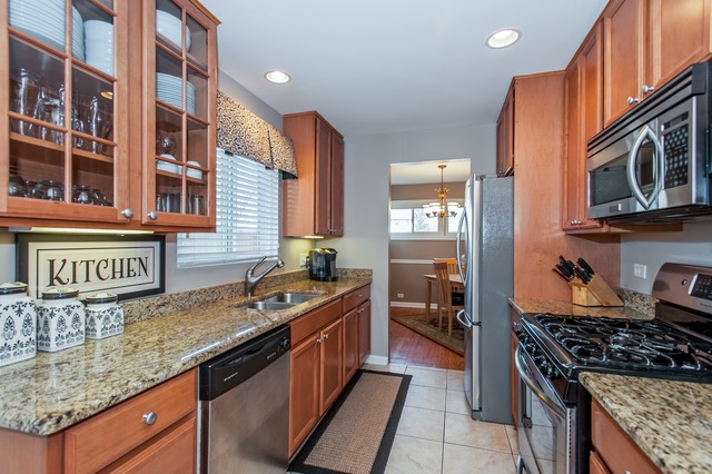 2519 Harrison Street Glenview, IL 60025 - Photo 4 of 10 a kitchen with stainless steel appliances granite countertop a stove and a sink