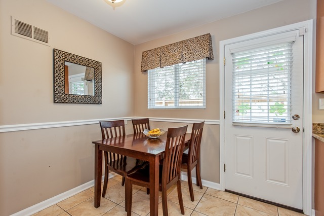 2519 Harrison Street Glenview, IL 60025 - Photo 5 of 10 a view of a dining room with furniture and a window
