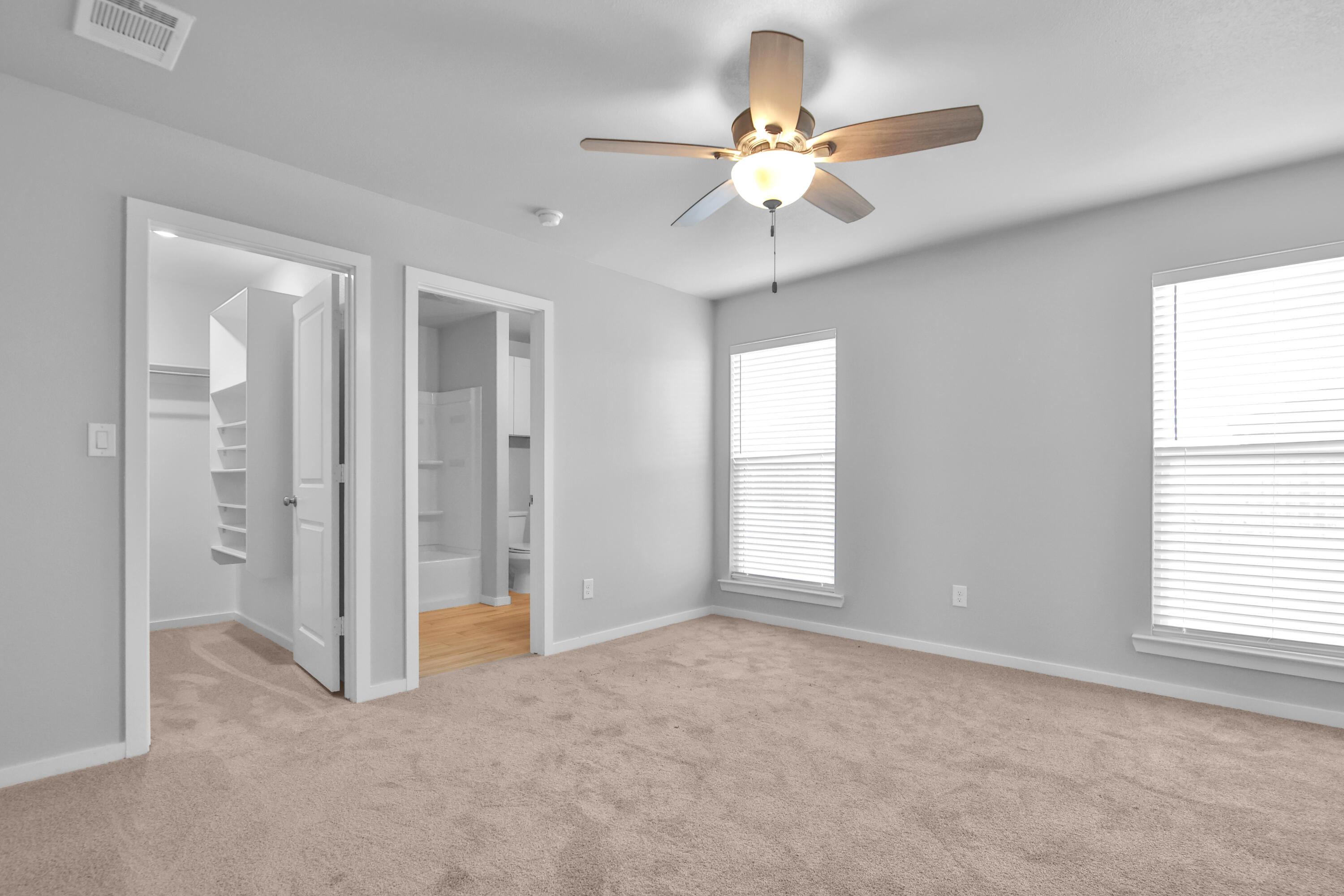 7526 104th Street Lubbock, TX 79424 - Photo 11 of 28 a view of an empty room with a window