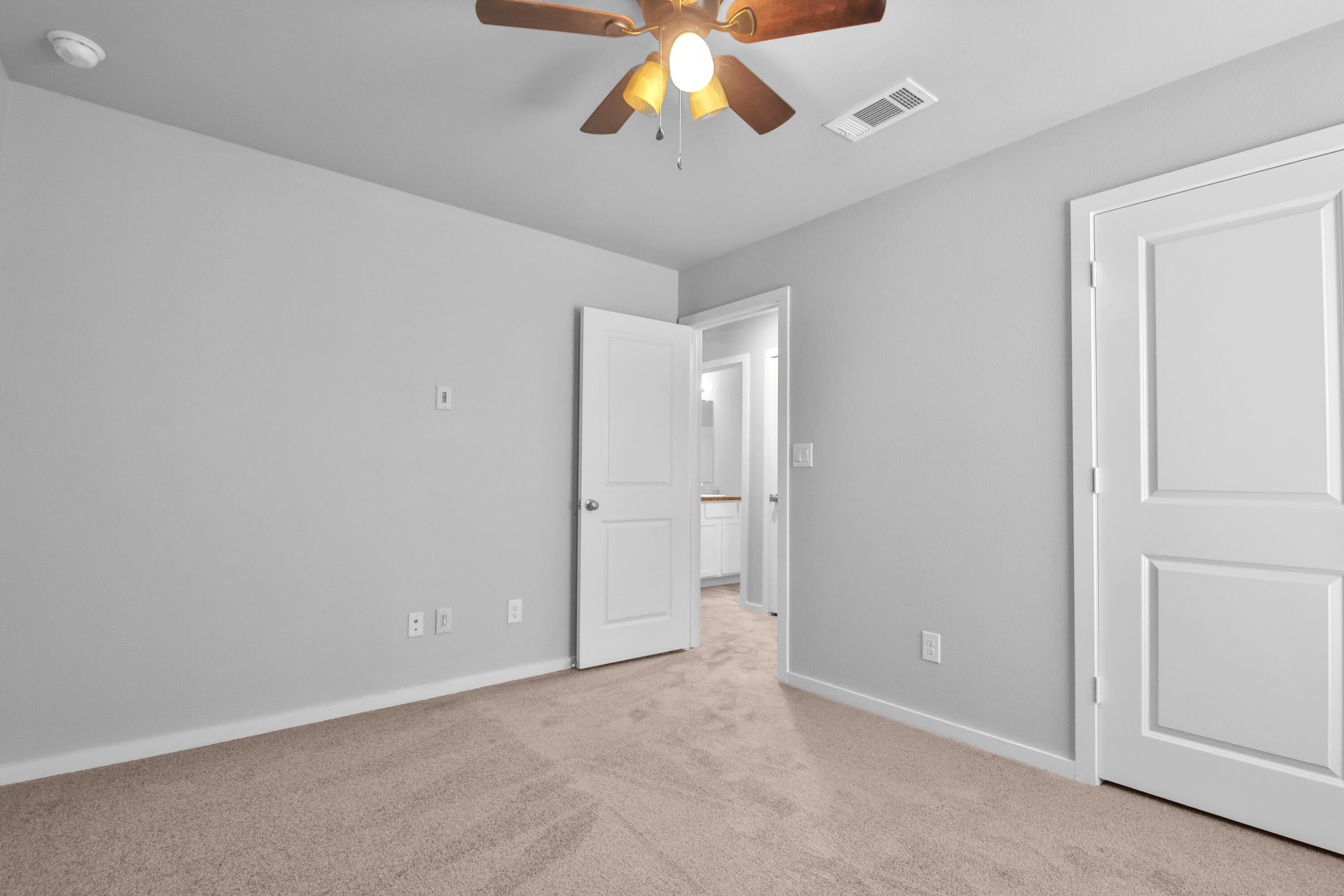 7526 104th Street Lubbock, TX 79424 - Photo 21 of 28 a view of an empty room and chandelier fan