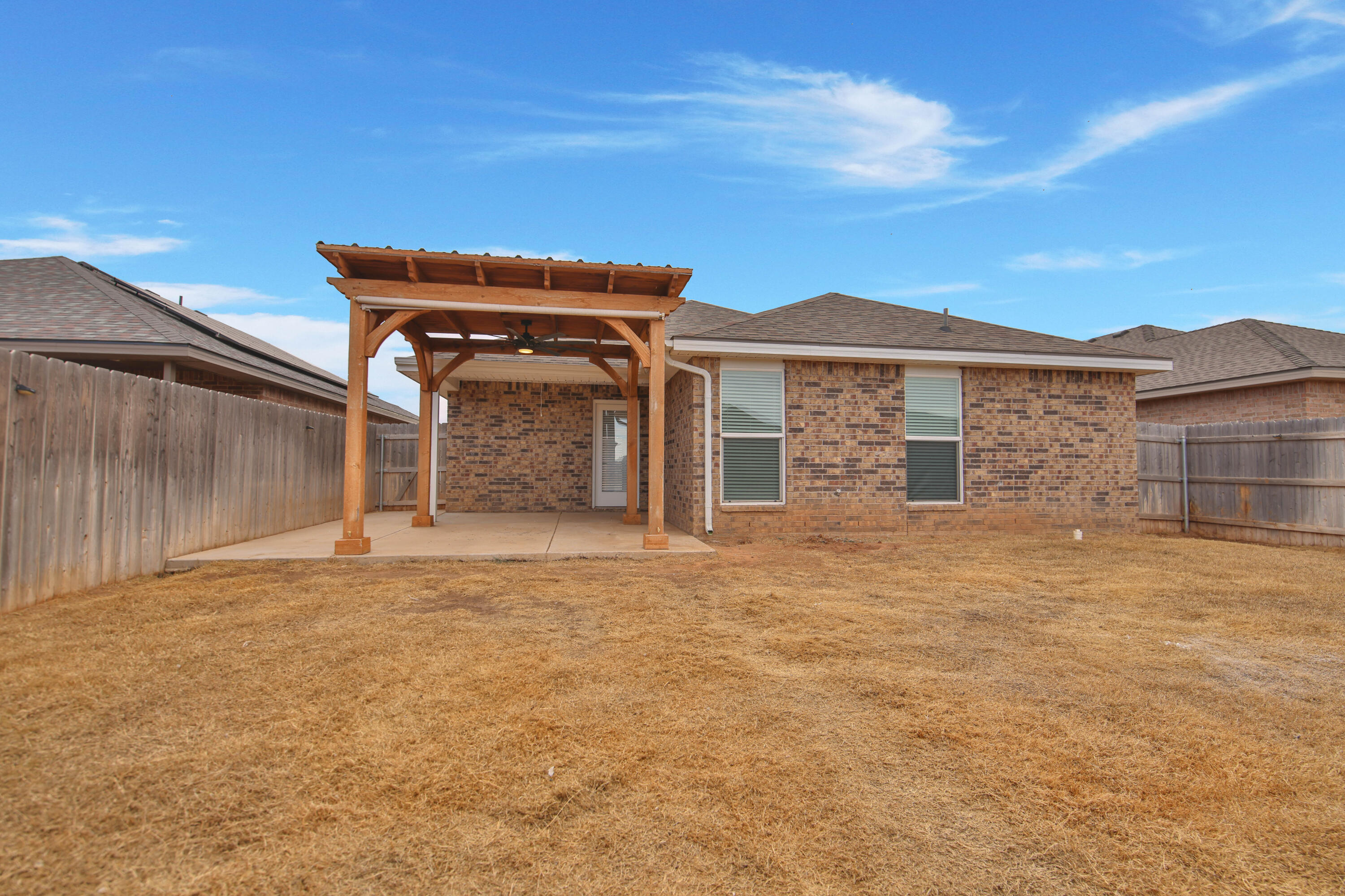 7526 104th Street Lubbock, TX 79424 - Photo 27 of 28 a front view of a house with a yard