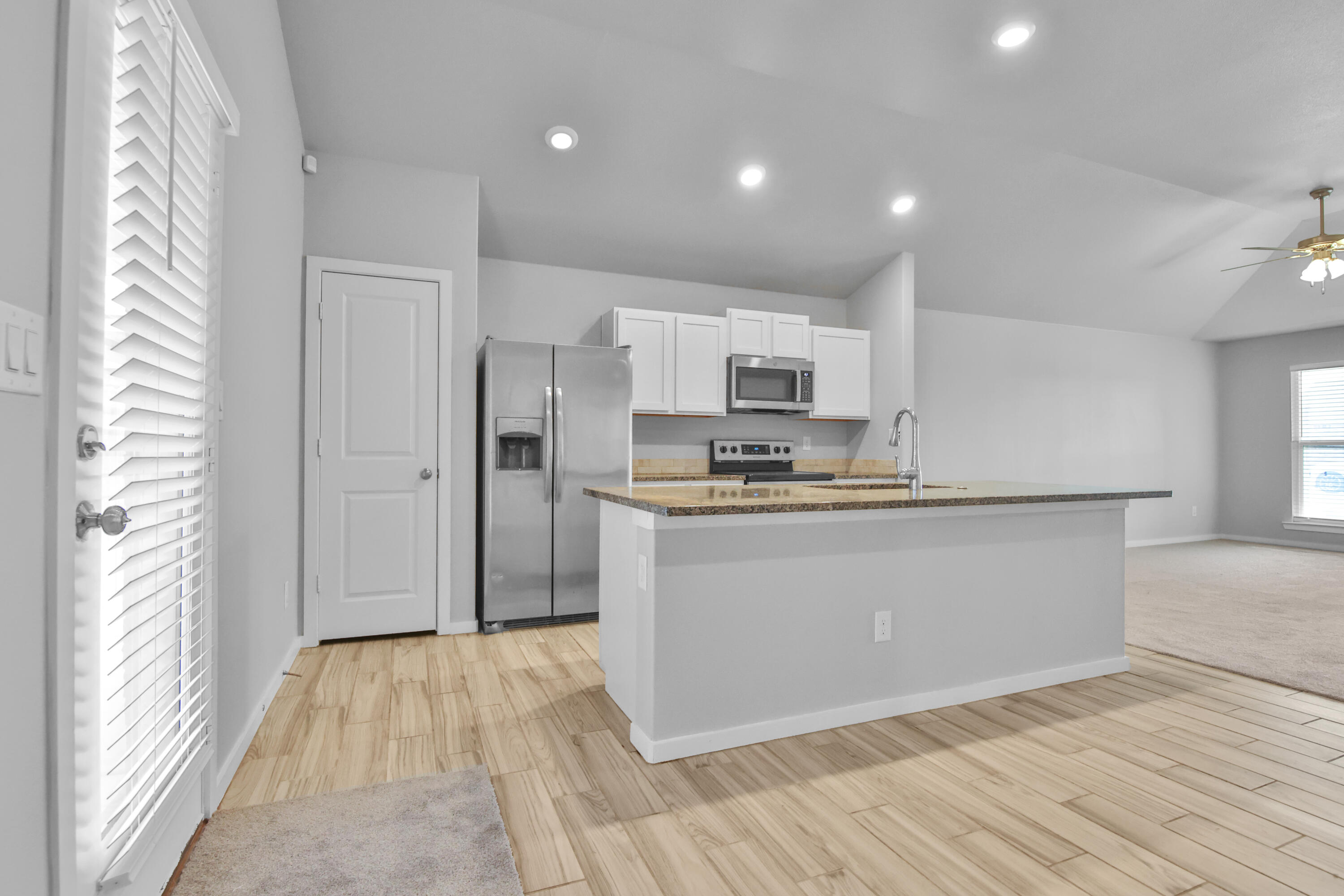 7526 104th Street Lubbock, TX 79424 - Photo 8 of 28 a view of kitchen with wooden floor
