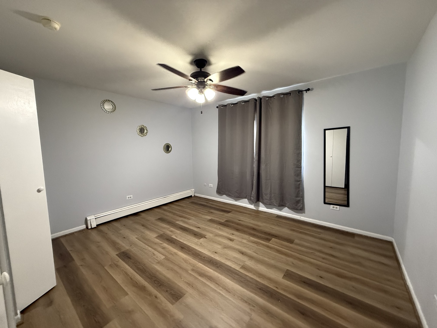 600 Mesa Drive, Unit 104 Hoffman Estates, IL 60169 - Photo 4 of 12 a view of an empty room with a window