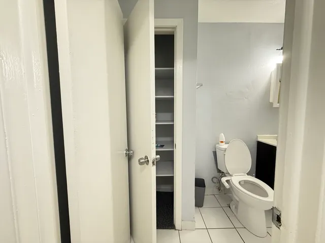 a bathroom with a toilet and a sink