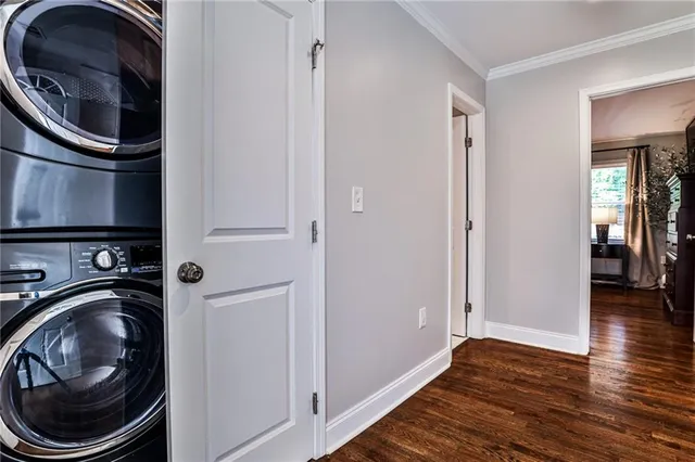 a view of a storage and utility room with wooden floor