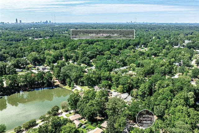a view of a lake with a house in the background