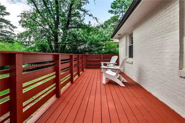 a view of deck with chairs and wooden floor