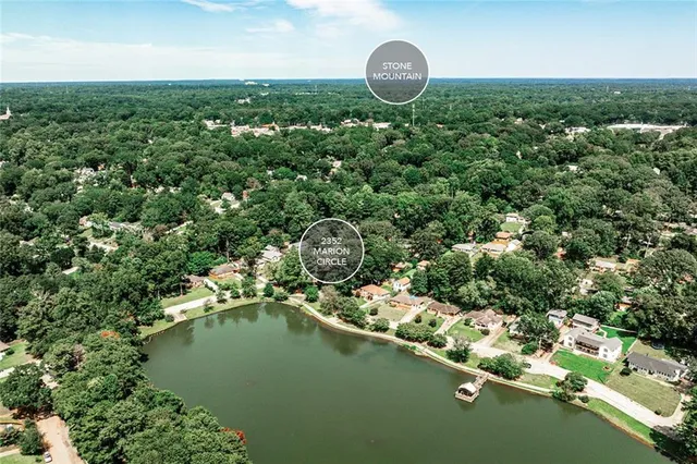 an aerial view of a house with a lake view
