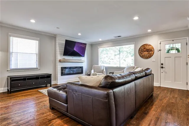 a living room with furniture a window and a fireplace