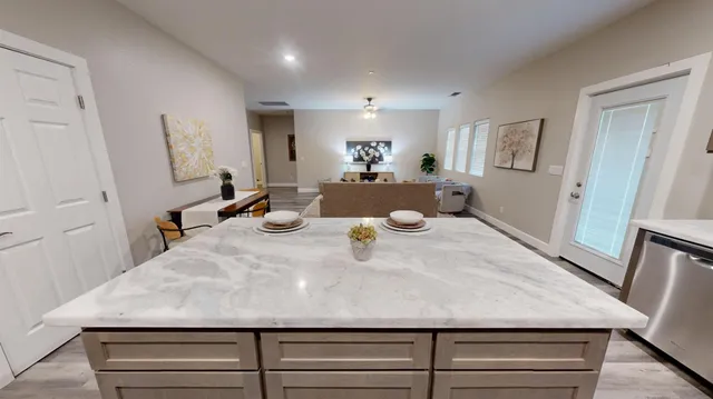 a view of a living room and entryway