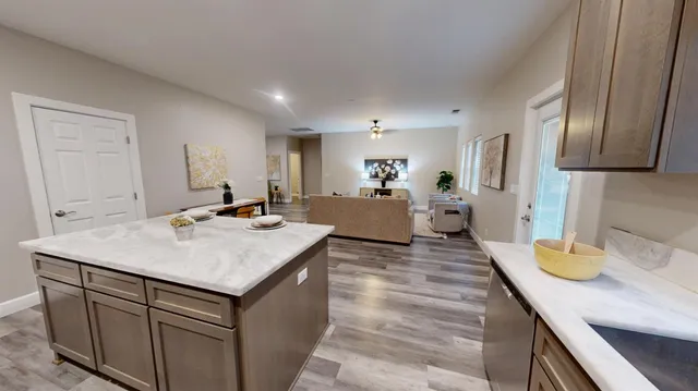 a kitchen with a sink and cabinets