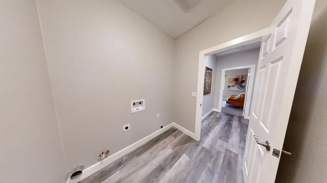 a view of a bedroom from a hallway