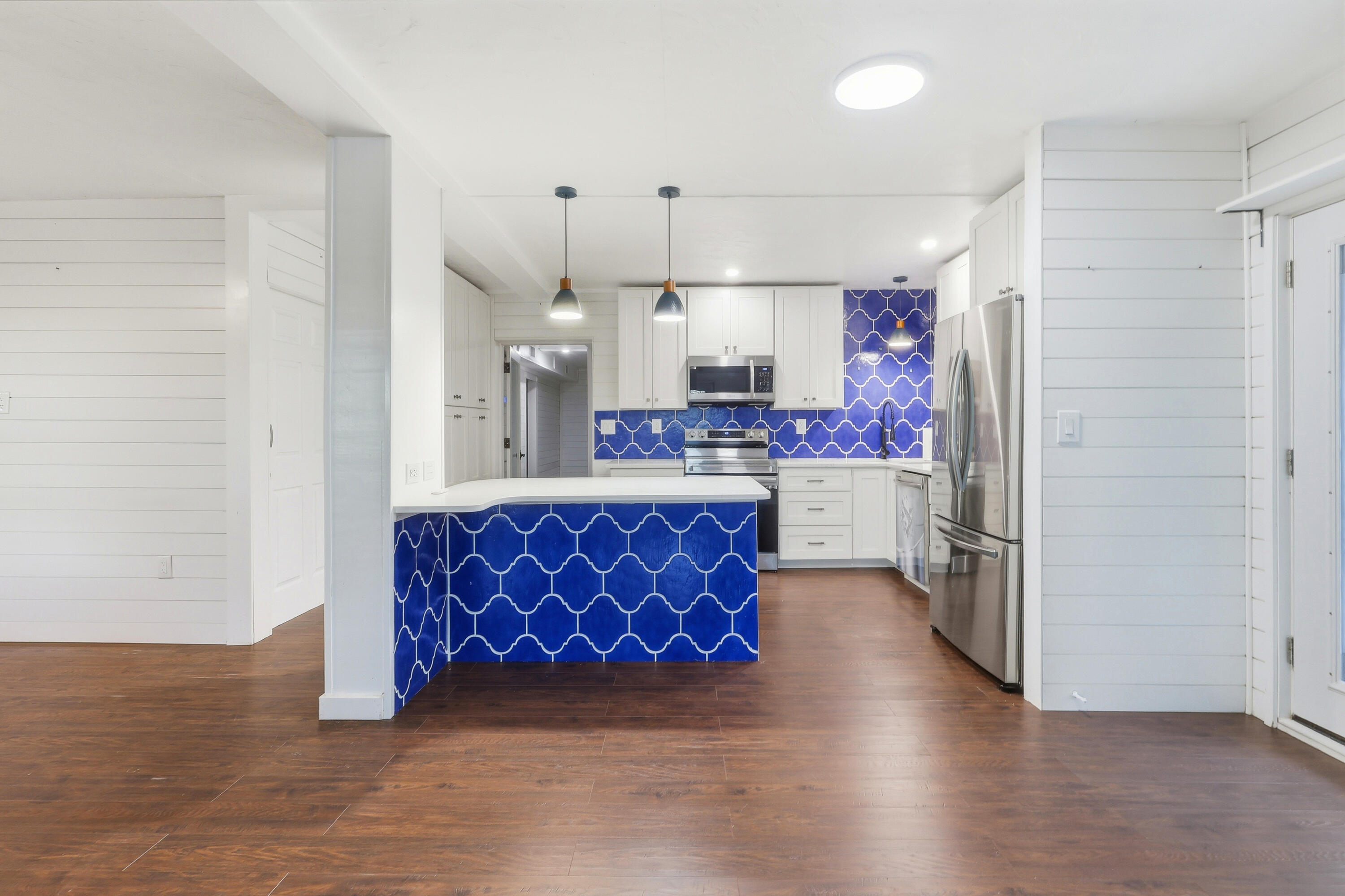 4578 Riley Road Milton, FL 32583 - Photo 12 of 55 a kitchen with stainless steel appliances granite countertop a sink a stove a refrigerator and cabinets