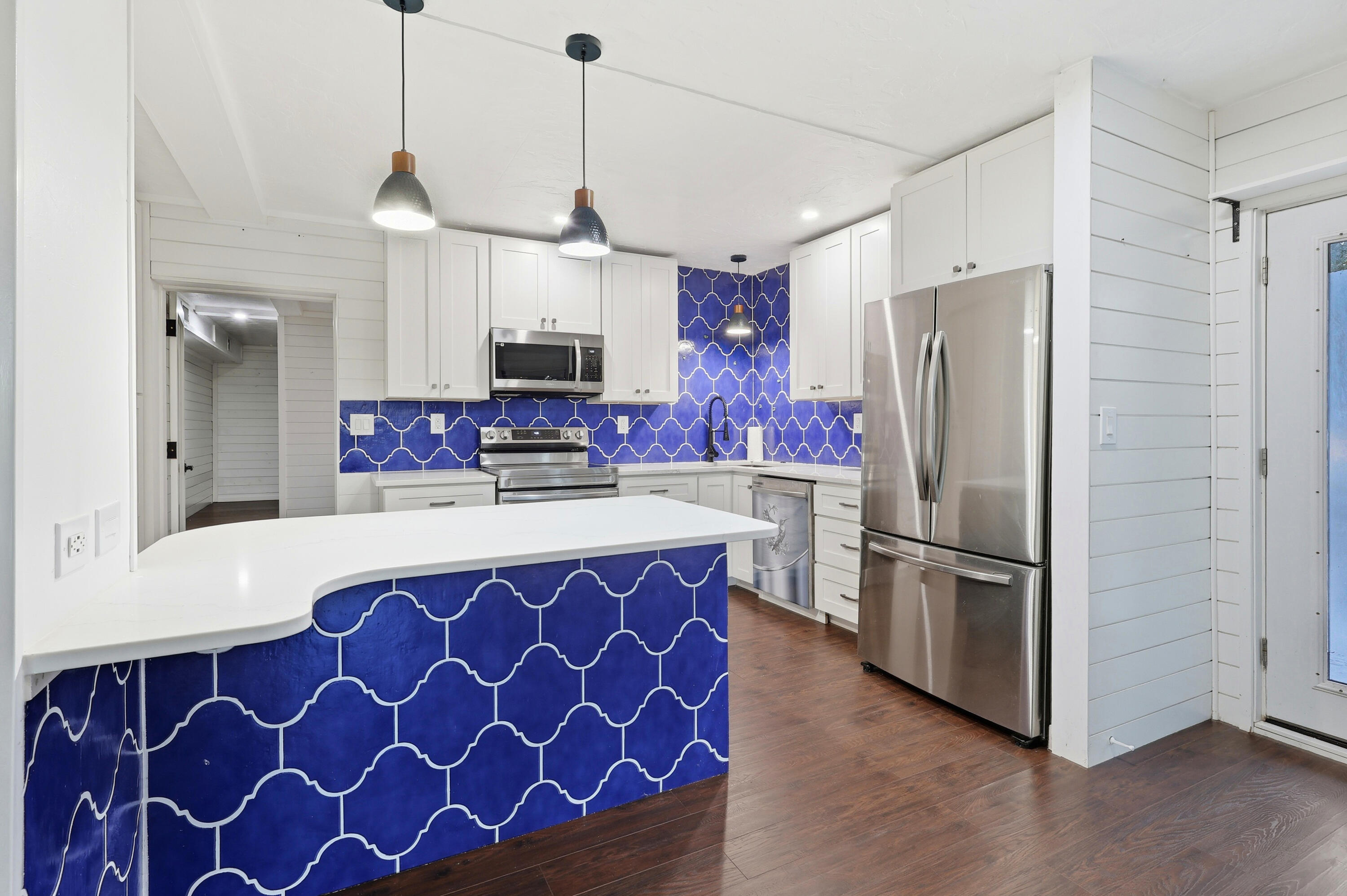 4578 Riley Road Milton, FL 32583 - Photo 13 of 55 a kitchen with stainless steel appliances a refrigerator sink and microwave