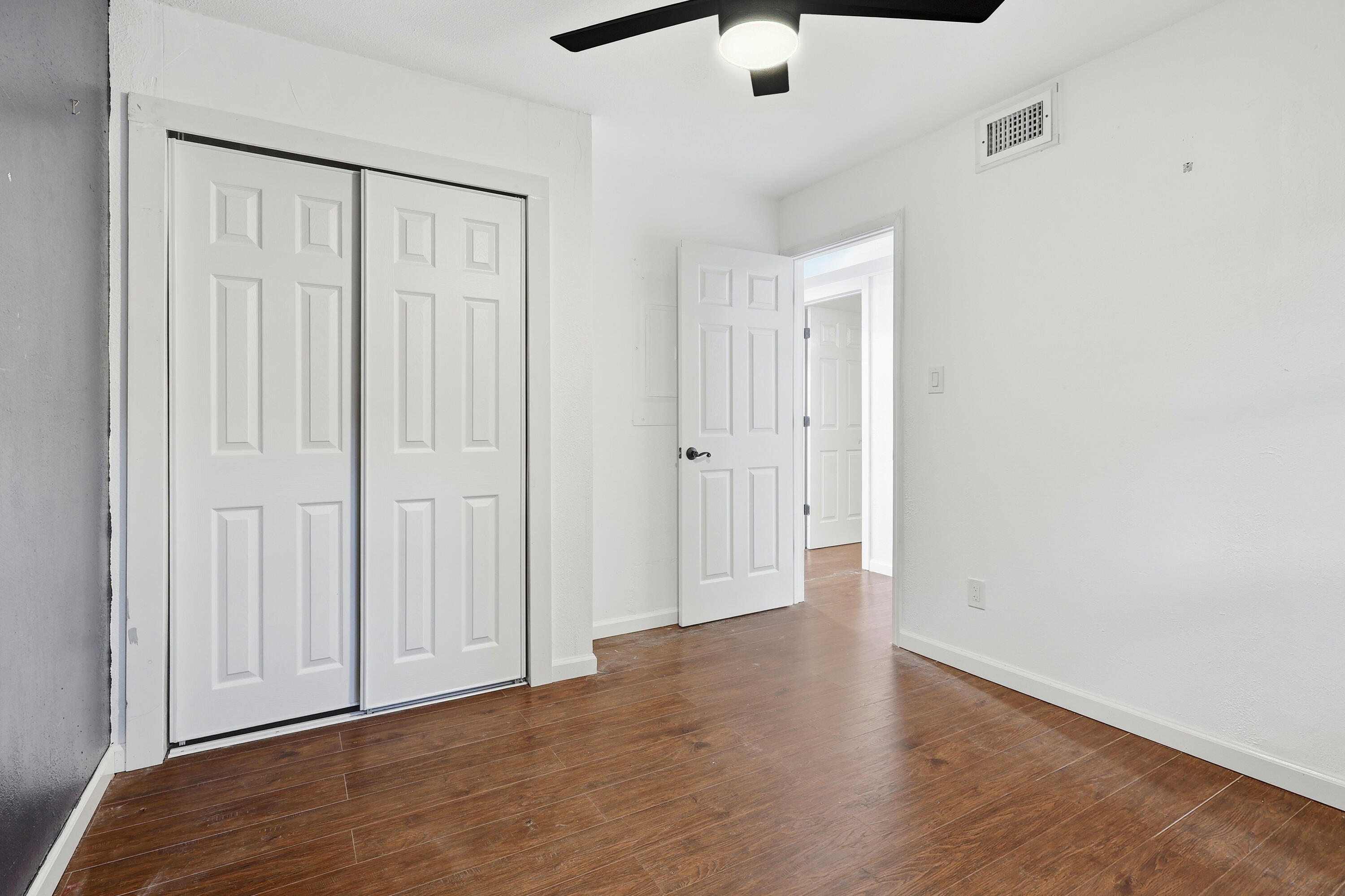 4578 Riley Road Milton, FL 32583 - Photo 31 of 55 a view of an empty room with wooden floor