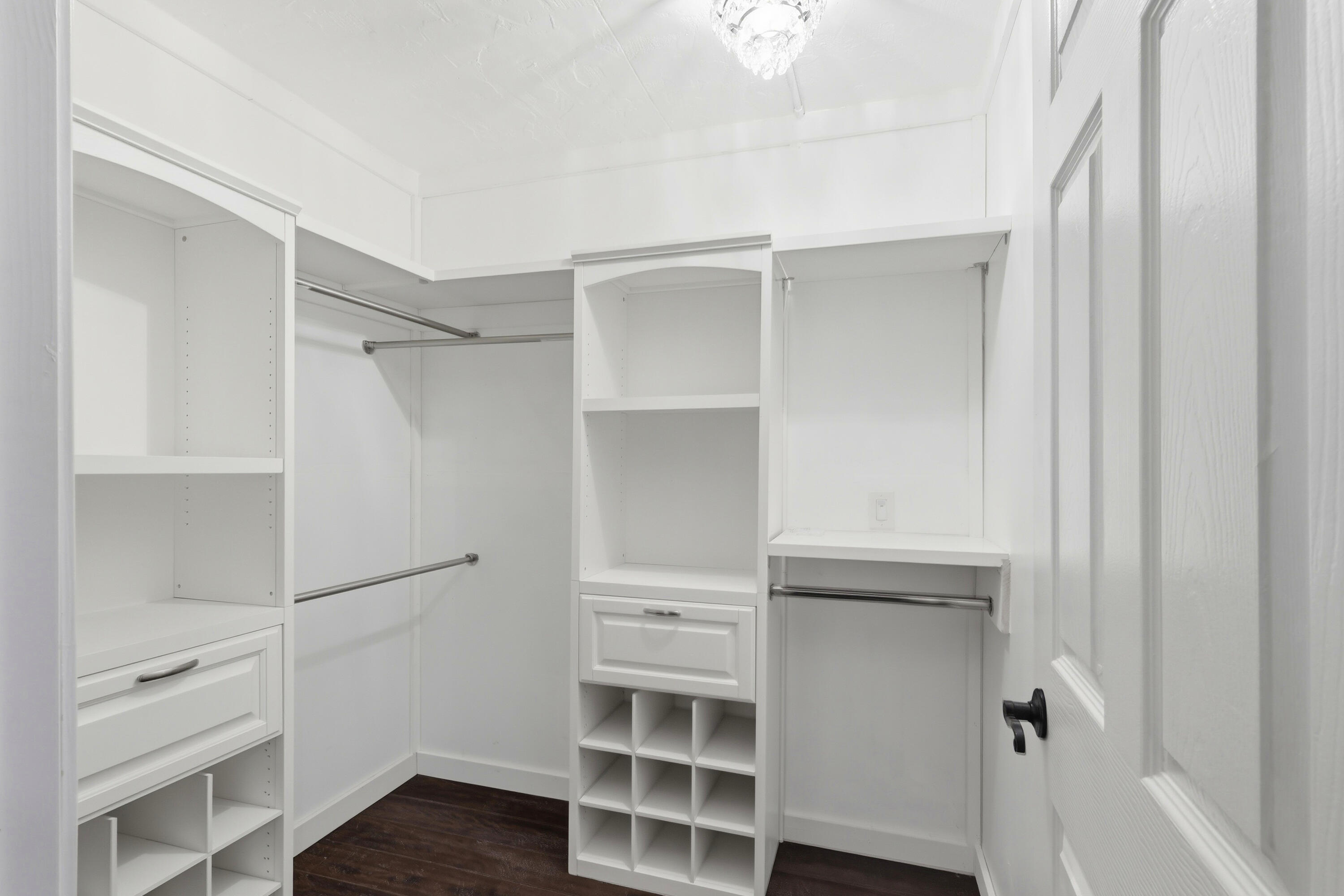 4578 Riley Road Milton, FL 32583 - Photo 33 of 55 a view of walk in closet with empty racks