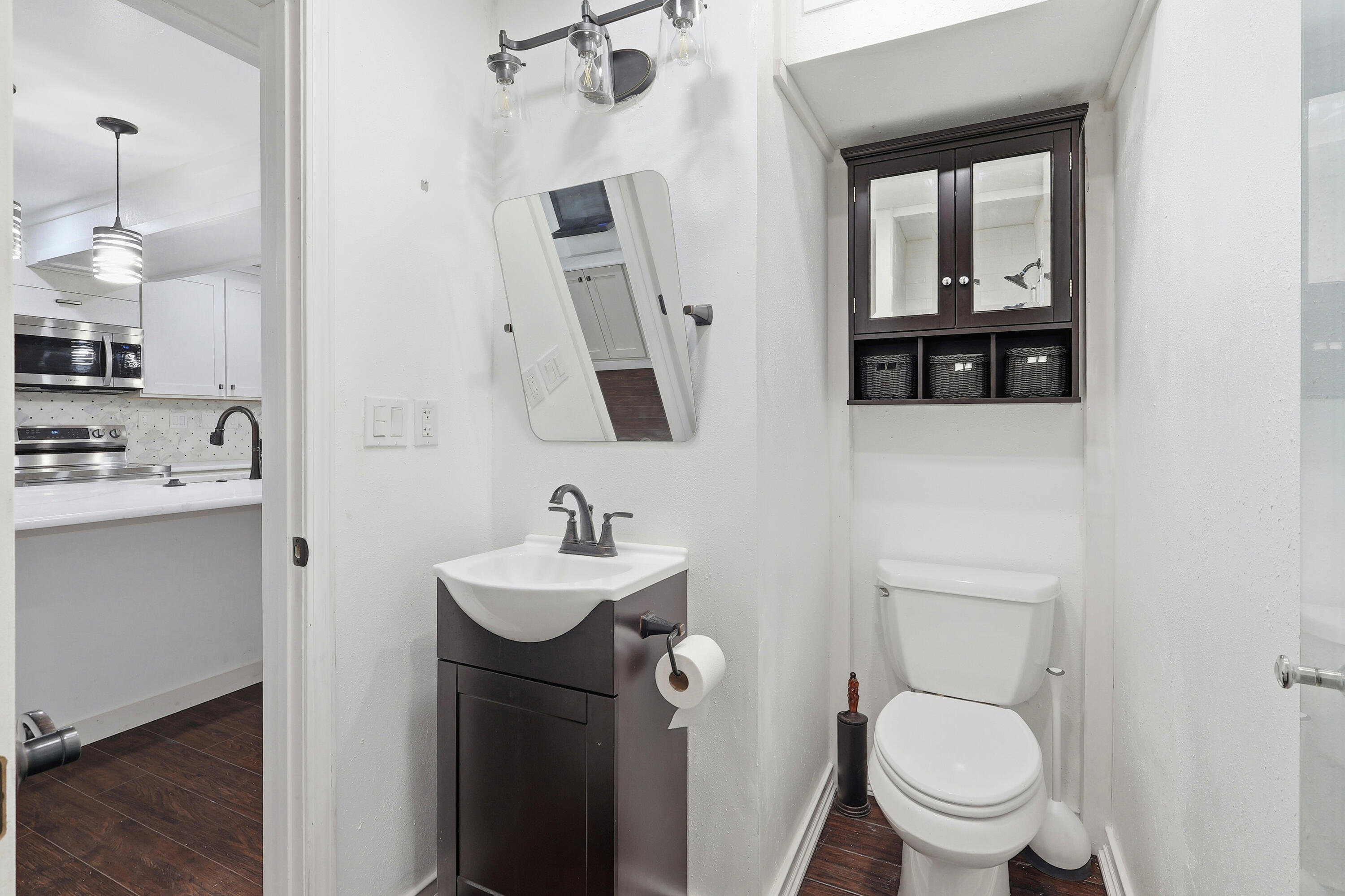 4578 Riley Road Milton, FL 32583 - Photo 35 of 55 a bathroom with a toilet sink and mirror