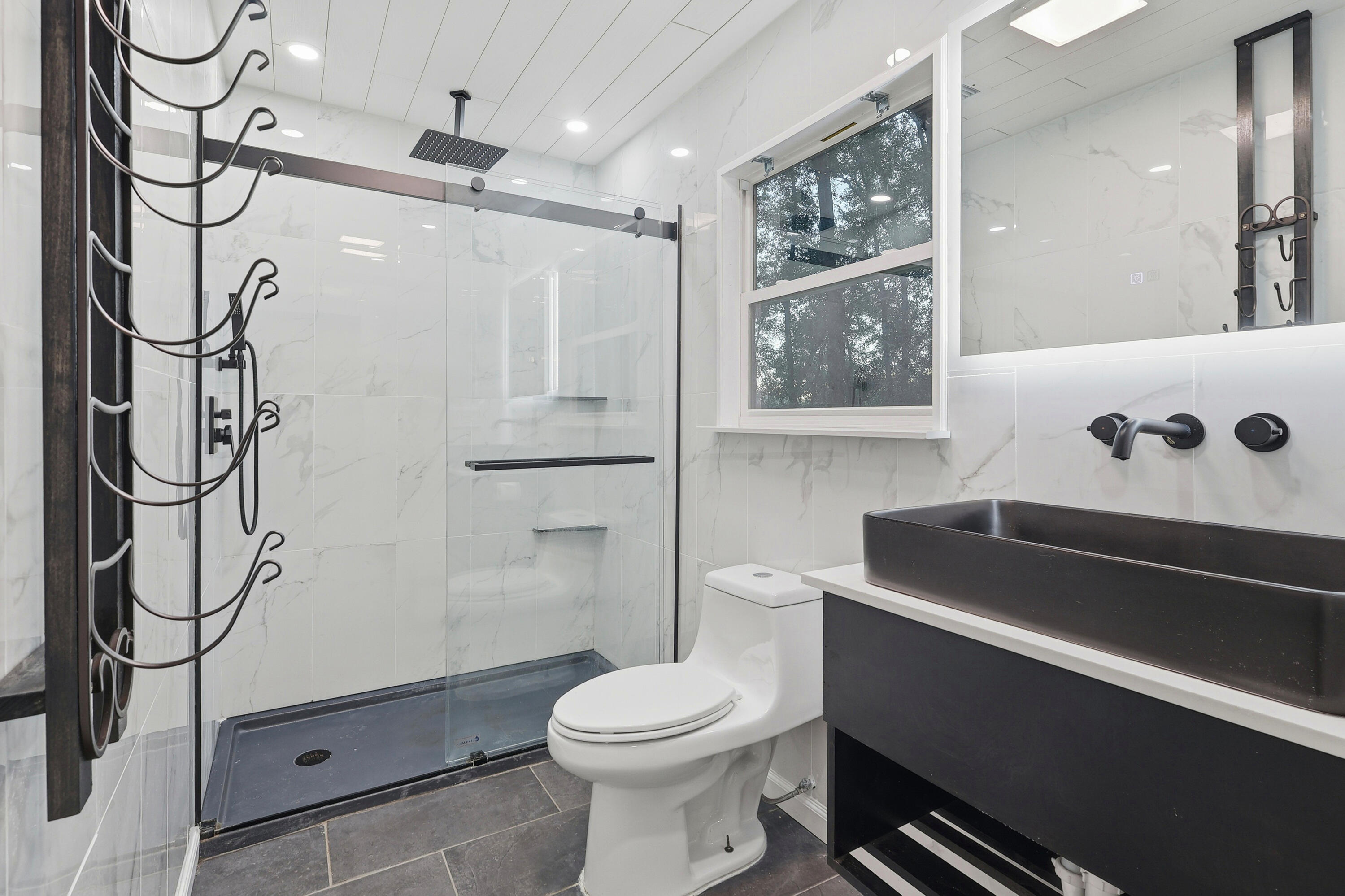 4578 Riley Road Milton, FL 32583 - Photo 37 of 55 a bathroom with a sink a toilet and shower