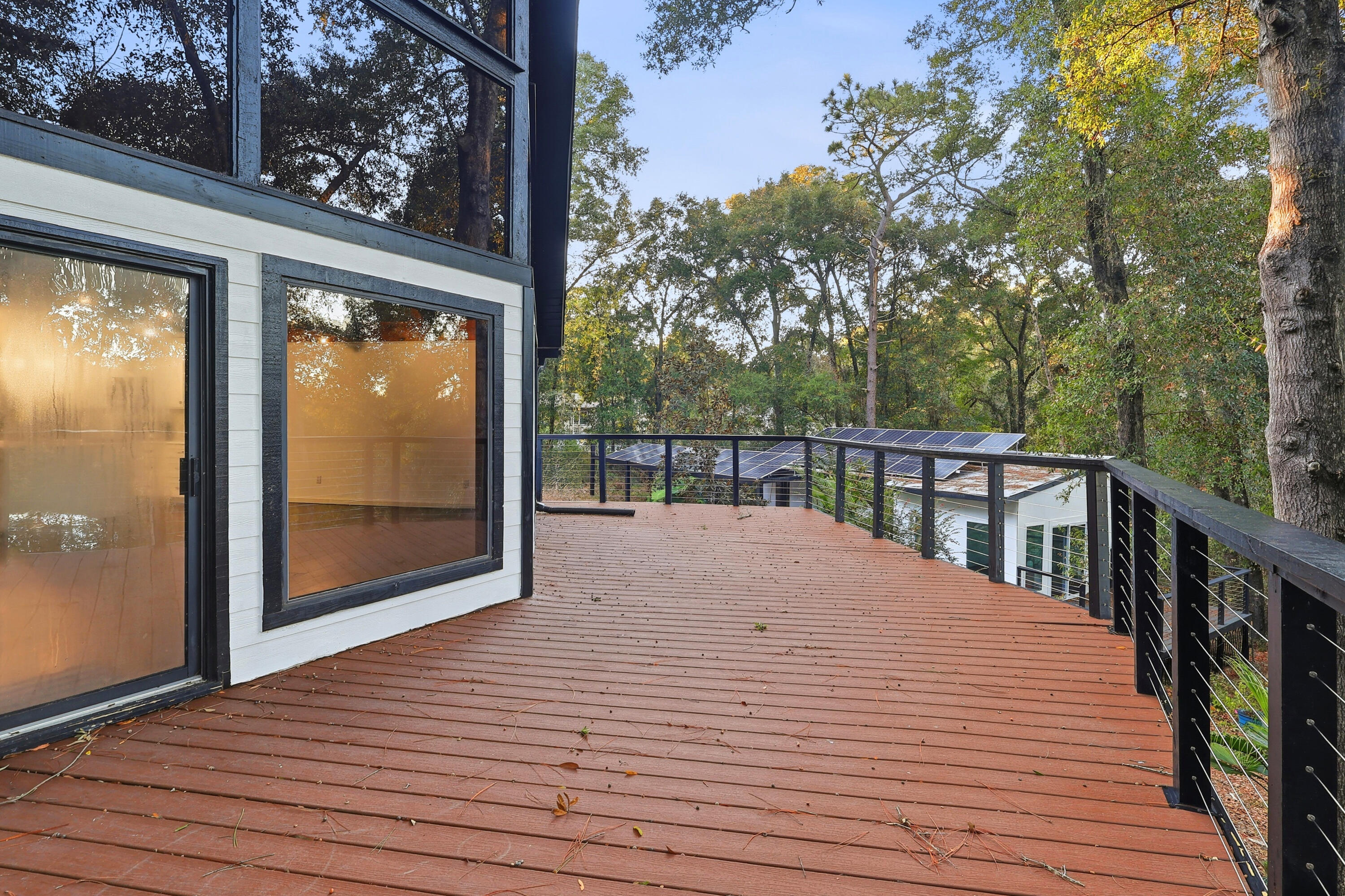 4578 Riley Road Milton, FL 32583 - Photo 45 of 55 a view of a balcony with wooden floor and floor to ceiling window and wooden fence