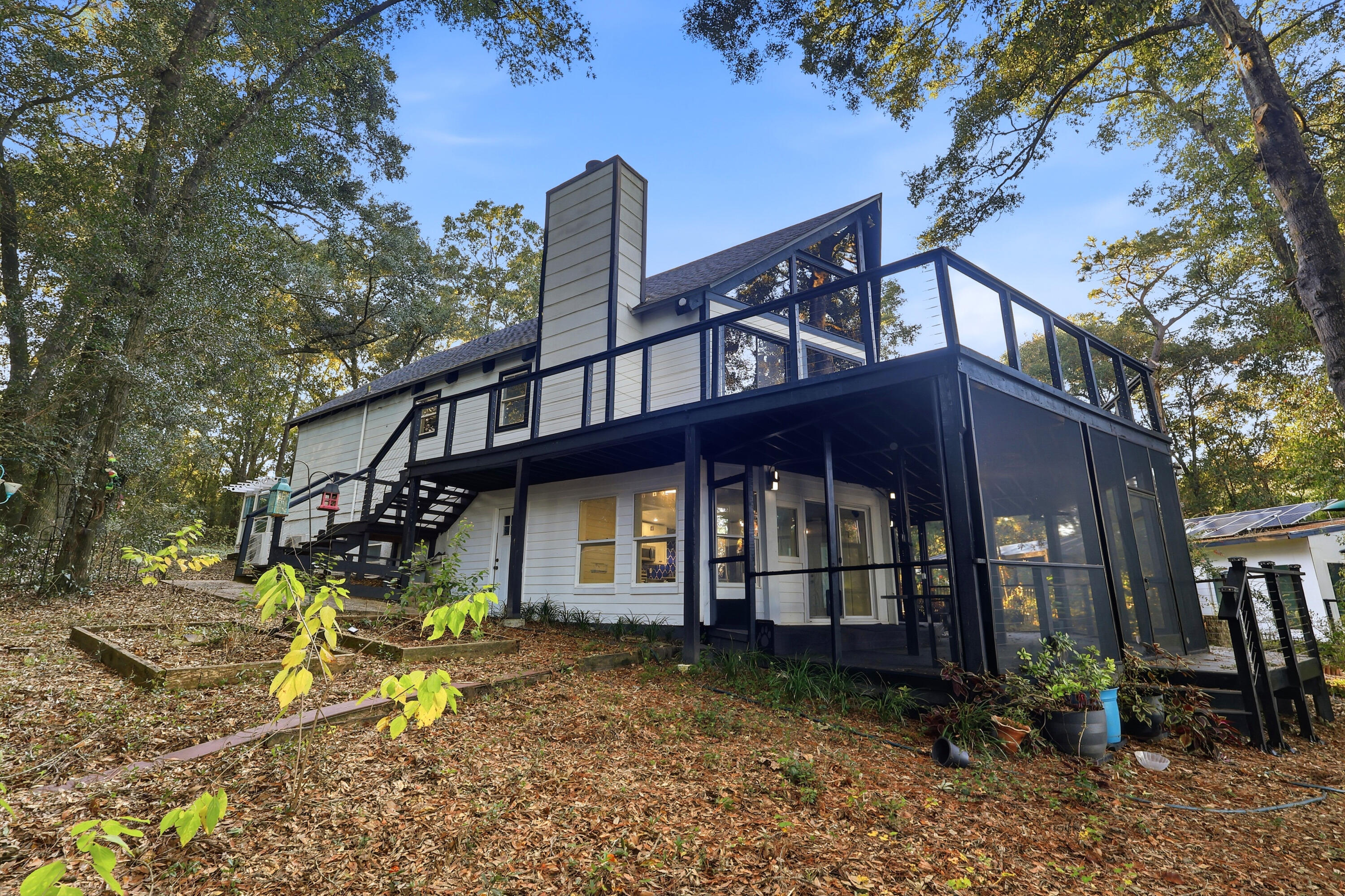 4578 Riley Road Milton, FL 32583 - Photo 49 of 55 a view of a house with a yard