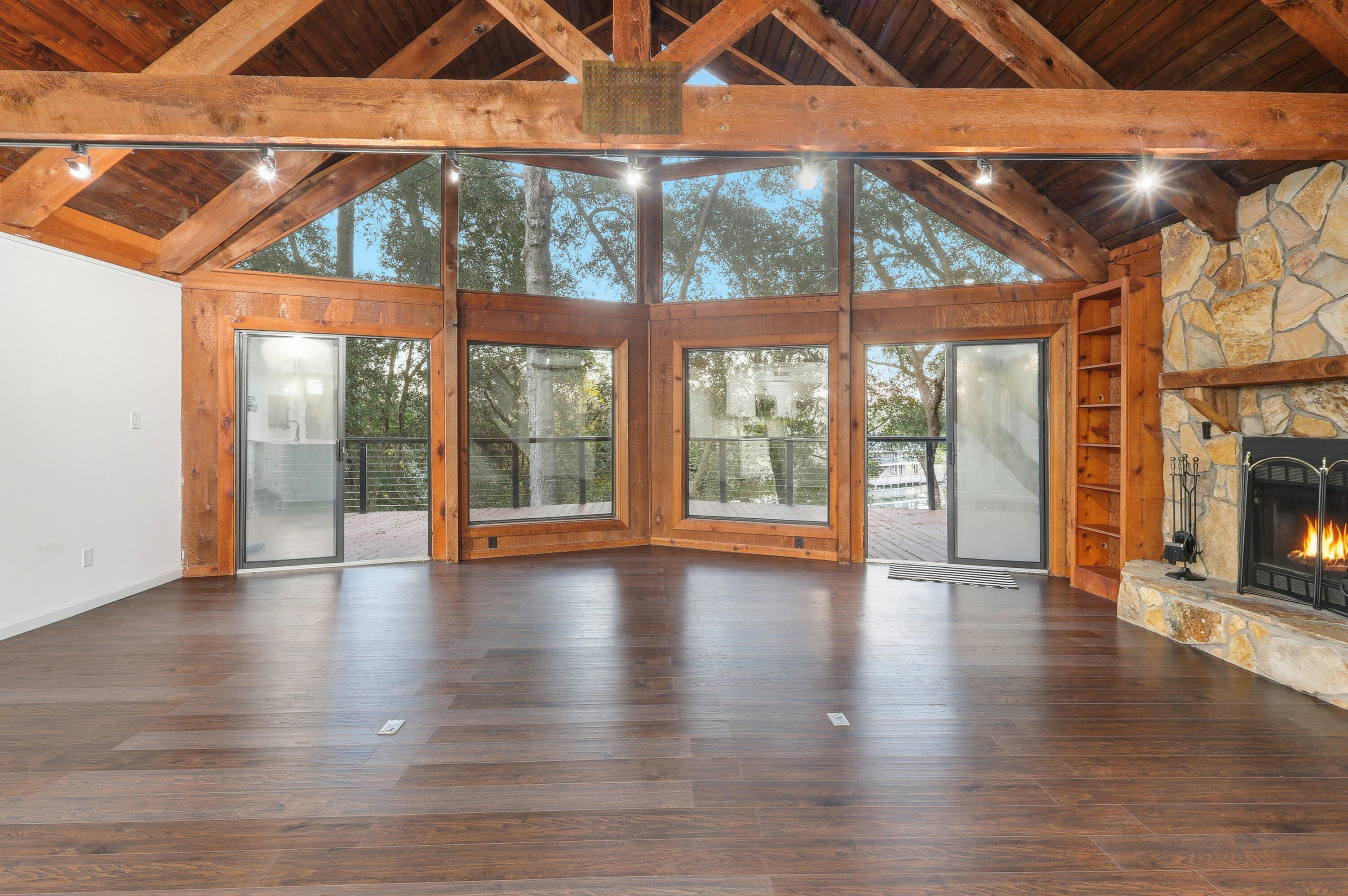 4578 Riley Road Milton, FL 32583 - Photo 8 of 55 a view of an empty room with wooden floor and a window