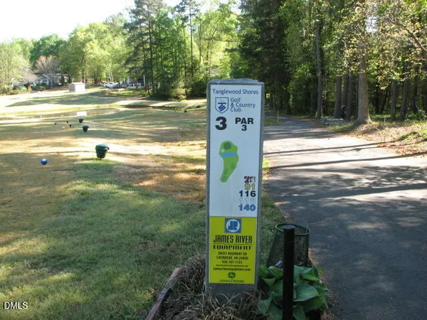 a view of a sign board with yard