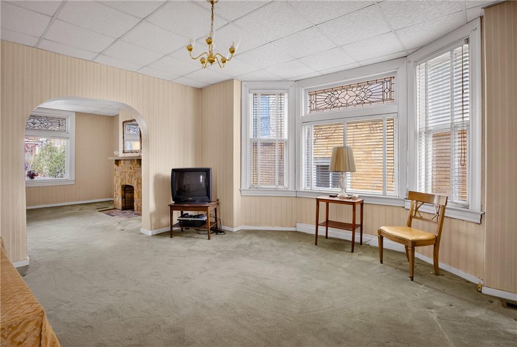417 Zara Street Pittsburgh, PA 15210 - Photo 15 of 47 a view of a livingroom with furniture and a window