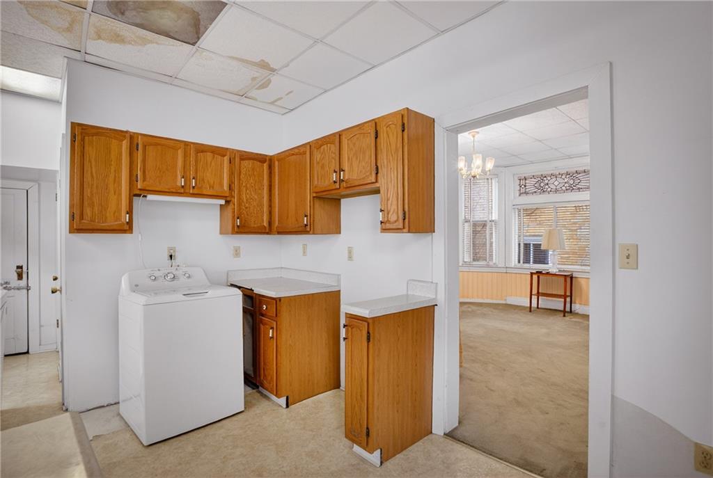 417 Zara Street Pittsburgh, PA 15210 - Photo 18 of 47 a kitchen with stainless steel appliances granite countertop a sink and a refrigerator