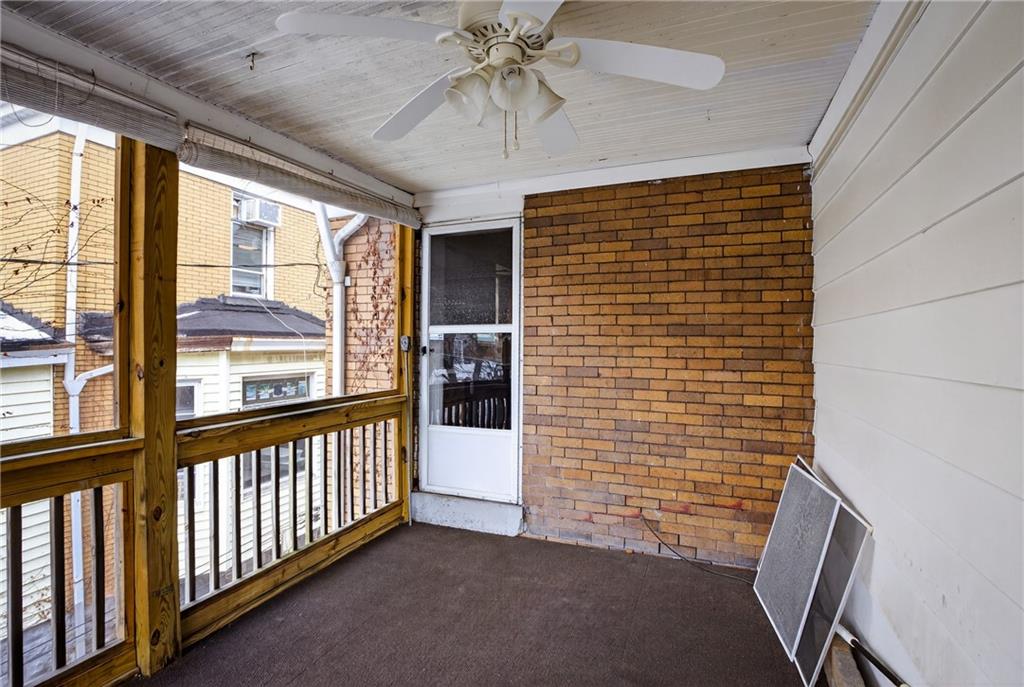 417 Zara Street Pittsburgh, PA 15210 - Photo 32 of 47 a view of a porch with wooden floor and outdoor space