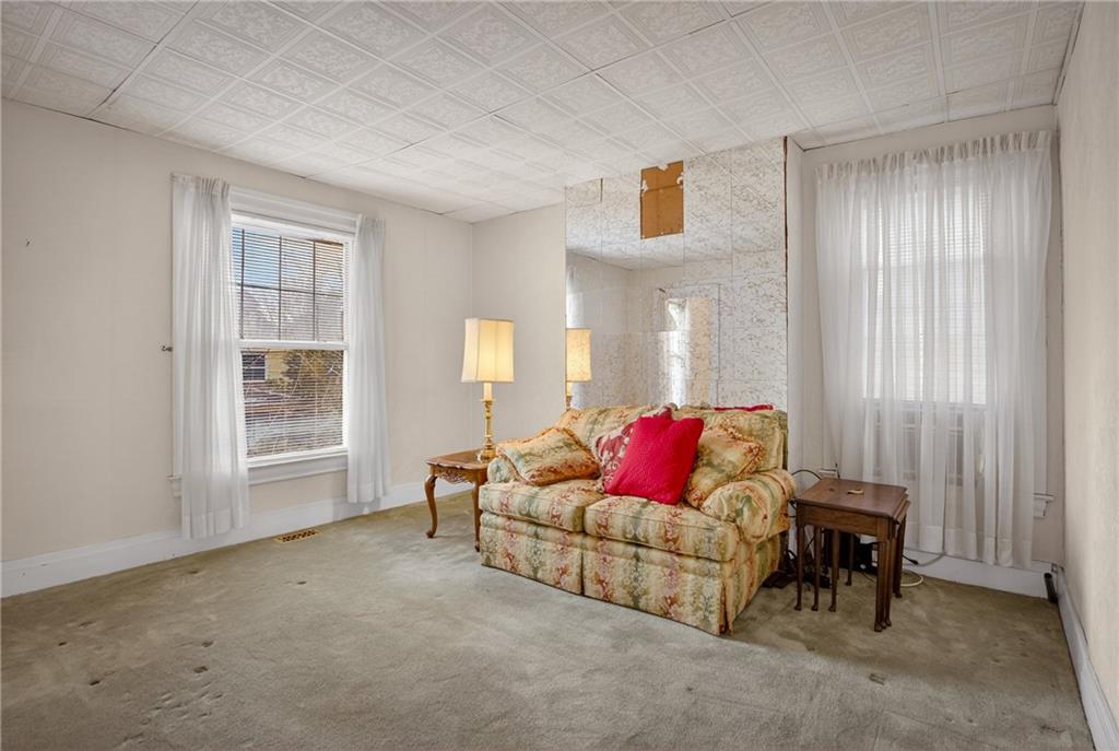 417 Zara Street Pittsburgh, PA 15210 - Photo 33 of 47 a living room with furniture and a window
