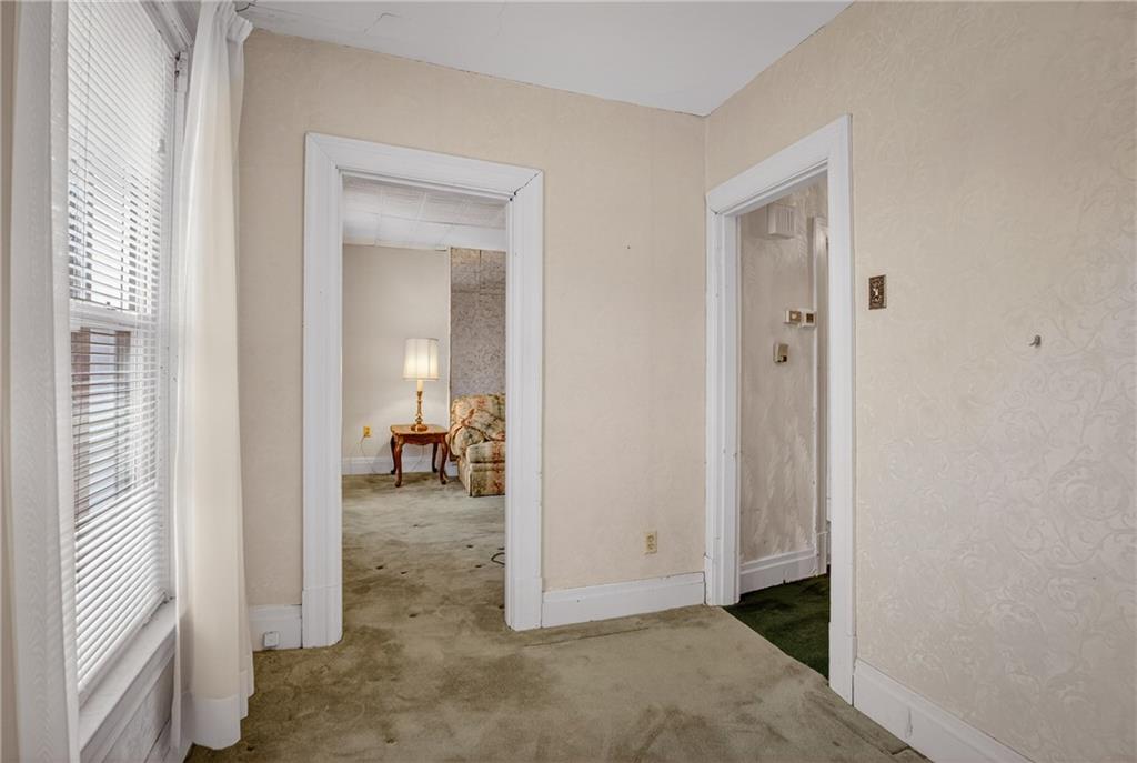 417 Zara Street Pittsburgh, PA 15210 - Photo 37 of 47 a view of a livingroom and a dining room with a bathroom