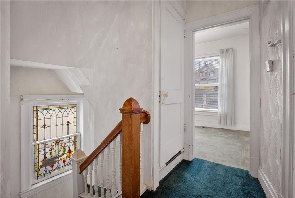 417 Zara Street Pittsburgh, PA 15210 - Photo 38 of 47 a view of entryway with a window and wooden floor
